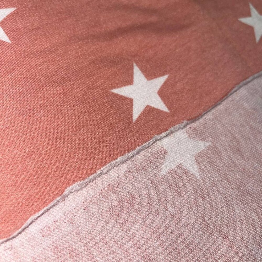 SOLD 
Coral Jersey Knit Fabric with a white star print 52"x60"